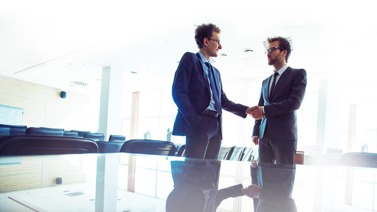 Two professionals in a meeting used as a decorative Sales Generator image