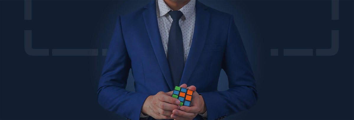 Decorative corporate image of a person holding a multicolour puzzle cube